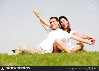 Cute young couple in a hands outstretched