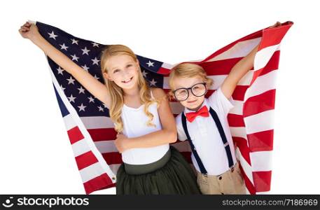 Cute Young Cuacasian Boy and Girl Holding American Flag Isolated On White Background.