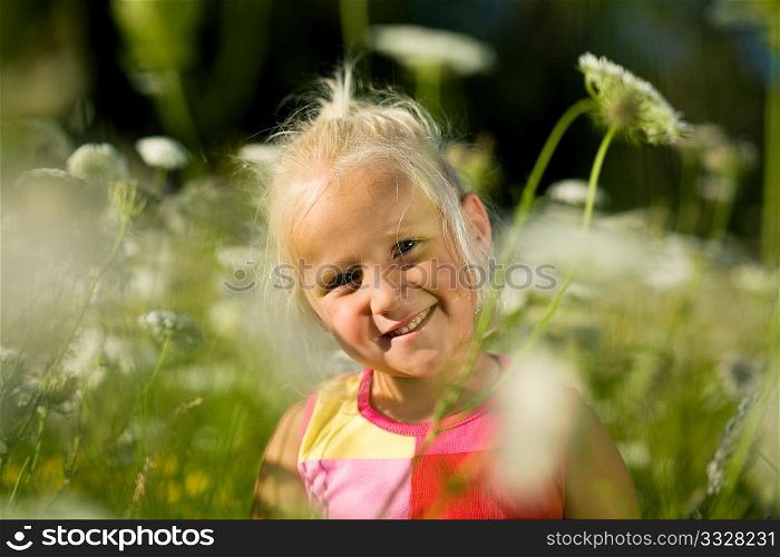 cute young girl in a field of yarrow