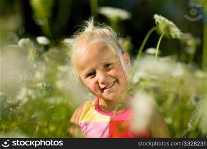cute young girl in a field of yarrow