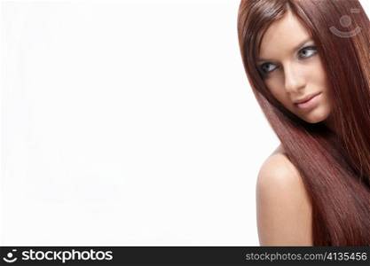Cute young girl with beautiful hair on a white background