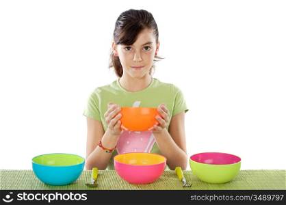 Cute young girl with empty colourful bowls