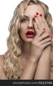 cute young girl with glamour make-up and long shiny wavy hair, red lipstick and nail polish