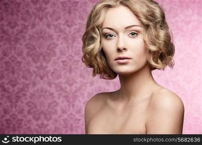cute young girl with natural look posing in beauty portrait with short curly hair-cut and perfect skin