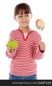Cute young girl with one lollipop and one apple over white background
