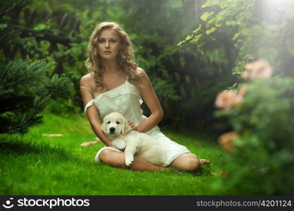 Cute young lady holding a puppy dog