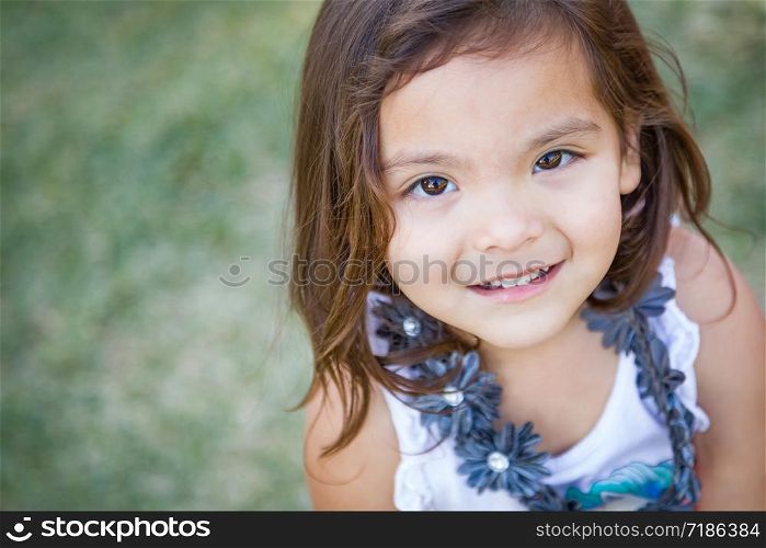Cute Young Mixed Race Baby Girl Portrait Outdoors.