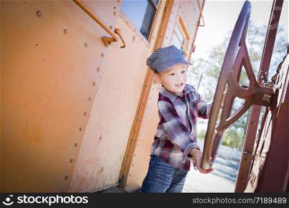 Cute Young Mixed Race Boy Having Fun Outside on Railroad Car.