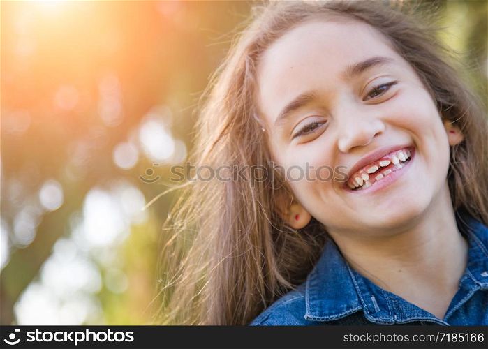 Cute Young Mixed Race Girl Having Fun Outdoors.
