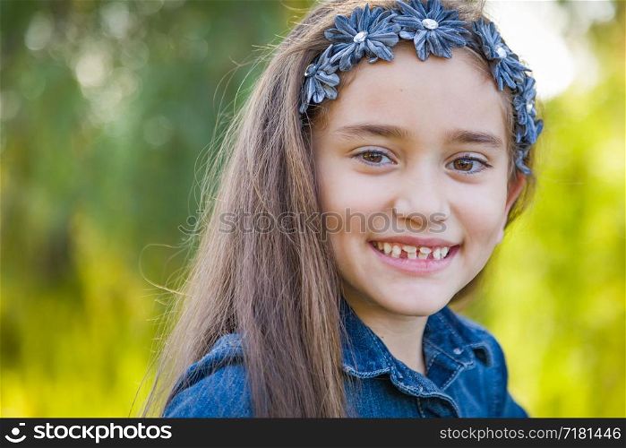 Cute Young Mixed Race Girl Portrait Outdoors.