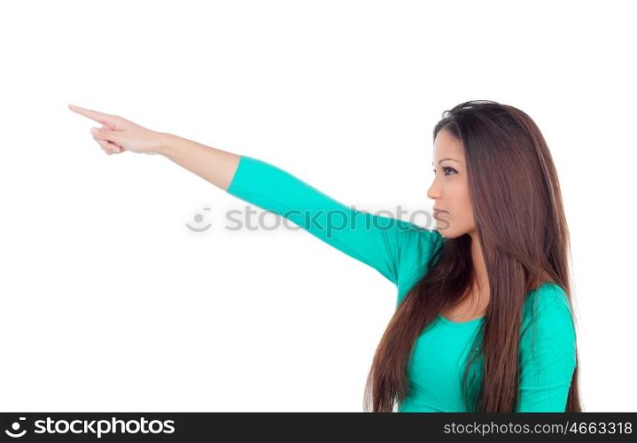 Cute young woman indicating something with the finger isolated on a white background