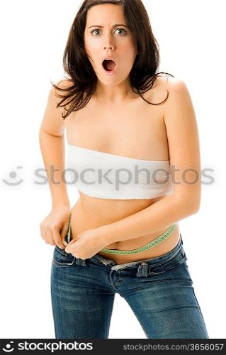 cute young woman measuring her body with a scale a tape measure