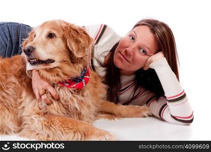 Cute young woman with her purebred Golden Retriever