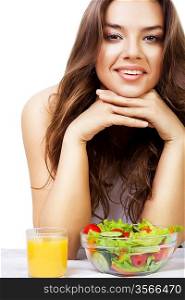 cute young woman with juice and salad on white background