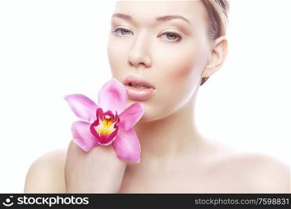 cute young woman with pink flower on white background