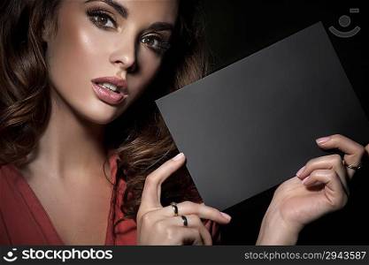Cutie with perfect skin holding an grey board