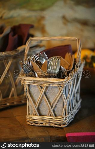 Cutlery in a basket