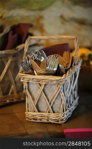 Cutlery in a basket