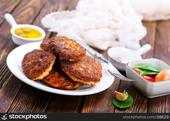 cutlets on white plate and on a table