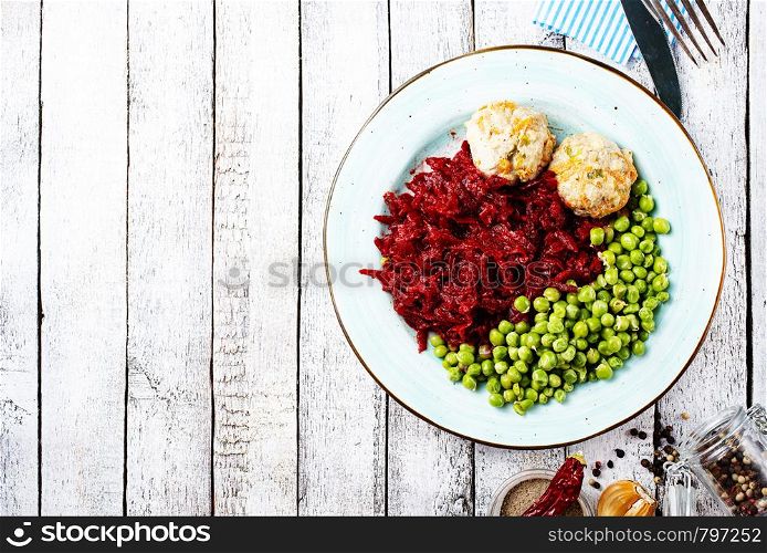 cutlets with fried green peas and beet