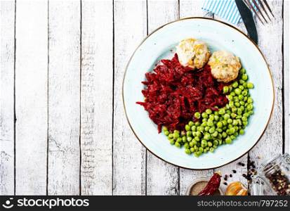 cutlets with fried green peas and beet