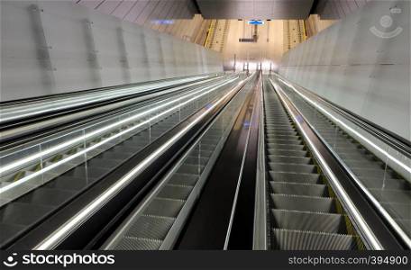 Cutout of multiple escalators in a train station