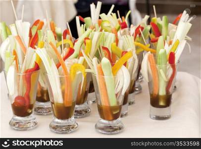 Cutted vegetables in glasses
