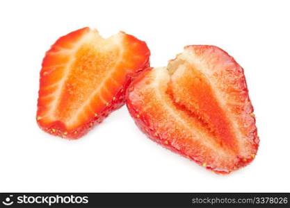 cutting a strawberry isolated on white