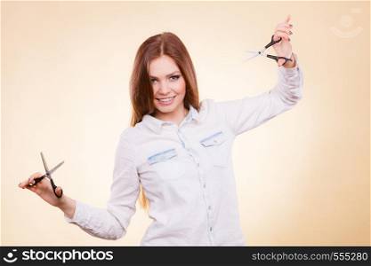 Cutting as a way of healthy strong hair. Girl barber with scissors ready to trimming. Female stylist holds trimmers prepared to haircut.. Female barber with trimmers scissors.