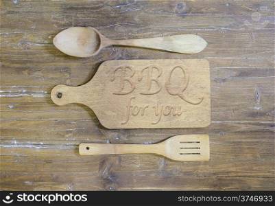 Cutting board and covered wooden in cooking with the word, BBQ.