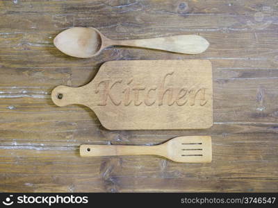 Cutting board and covered wooden in cooking with the word, kitchen.