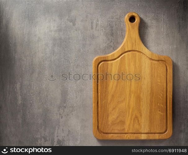 cutting board at grey stone table background texture