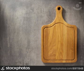 cutting board at grey stone table background texture