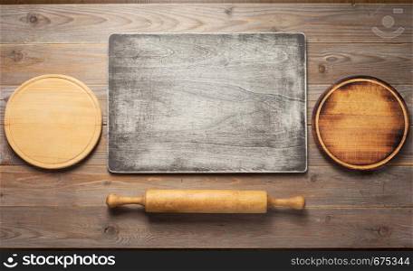 cutting board at wooden plank table board background, top view