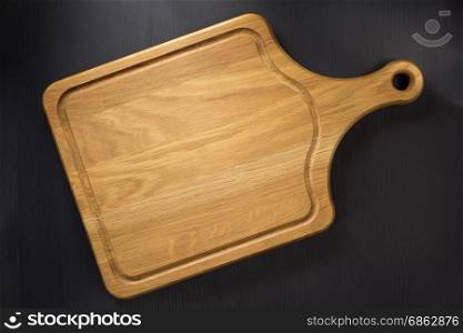 cutting board at wooden table surface