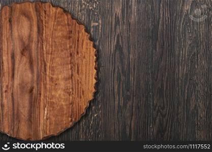 cutting board on a wooden table, background. cutting board on a wooden table