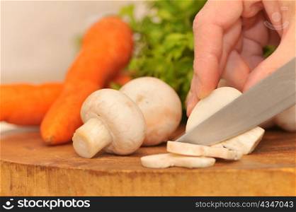 cutting champignon mushroom