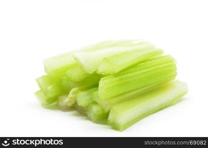 Cutting fresh bunch of celery isolated over white background