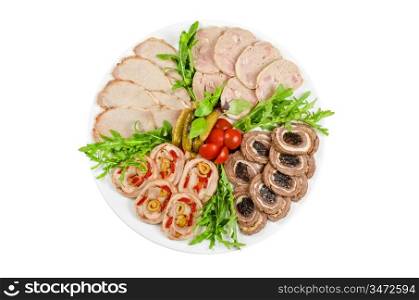 Cutting meat tenderloin with prune, olive, pepper, lettuce, tomatoes, cucumbers and ruccola at plate on a white