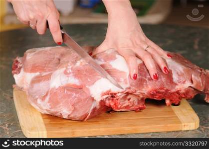 cutting of the big piece of meat