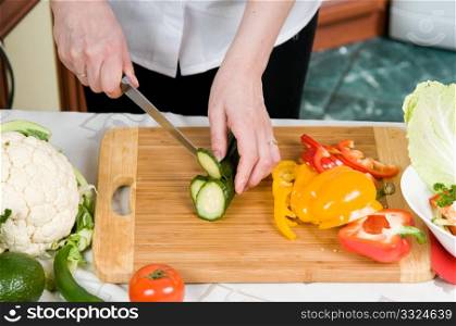 Cutting of vegetables on a chopping board