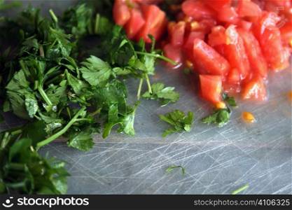 cutting parsley and tomato