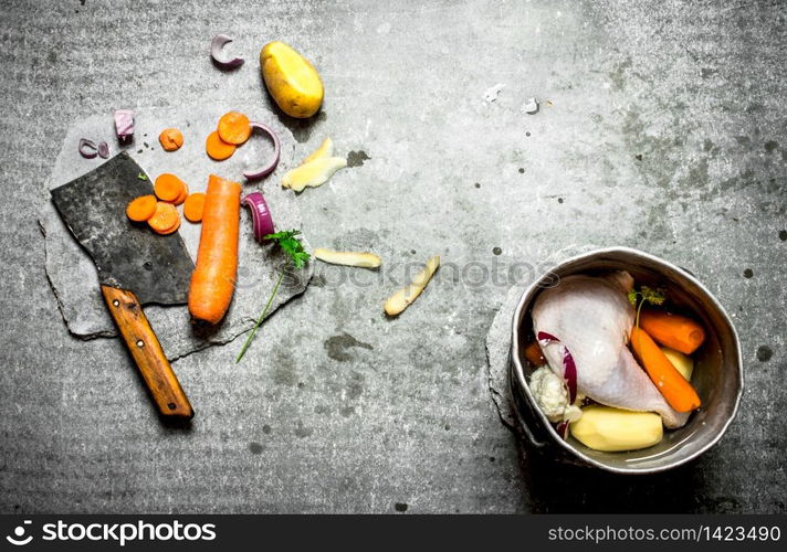 Cutting vegetables for chicken soup. On the stone table. Cutting vegetables for chicken soup.