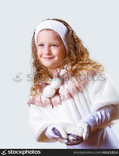 Cuty little girl in winter wear happy about new year