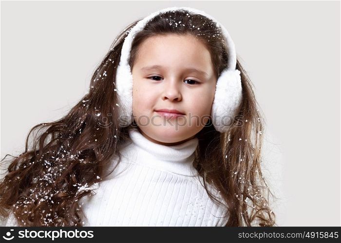 Cuty little girl in winter wear happy about new year