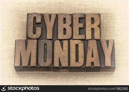 Cyber Monday - internet holiday shopping - text in vintage letterpress wood type against burlap canvas, sepia toned image