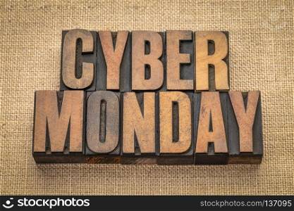 Cyber Monday - internet holiday shopping - text in vintage letterpress wood type against burlap canvas