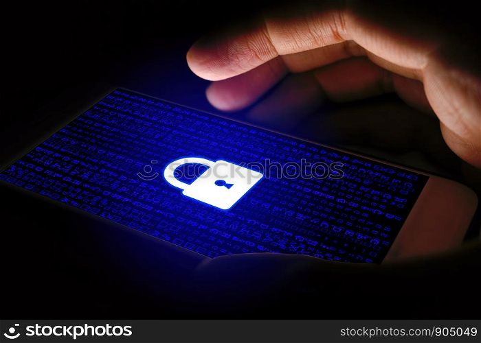 Cyber security concept, Man using smartphone and lock icon on virtual screen.