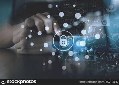 cyber security internet and networking concept.Businessman hand working with VR screen padlock icon on computer background