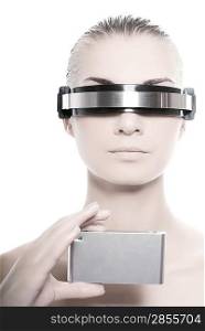 Cyber woman holding silver gadget